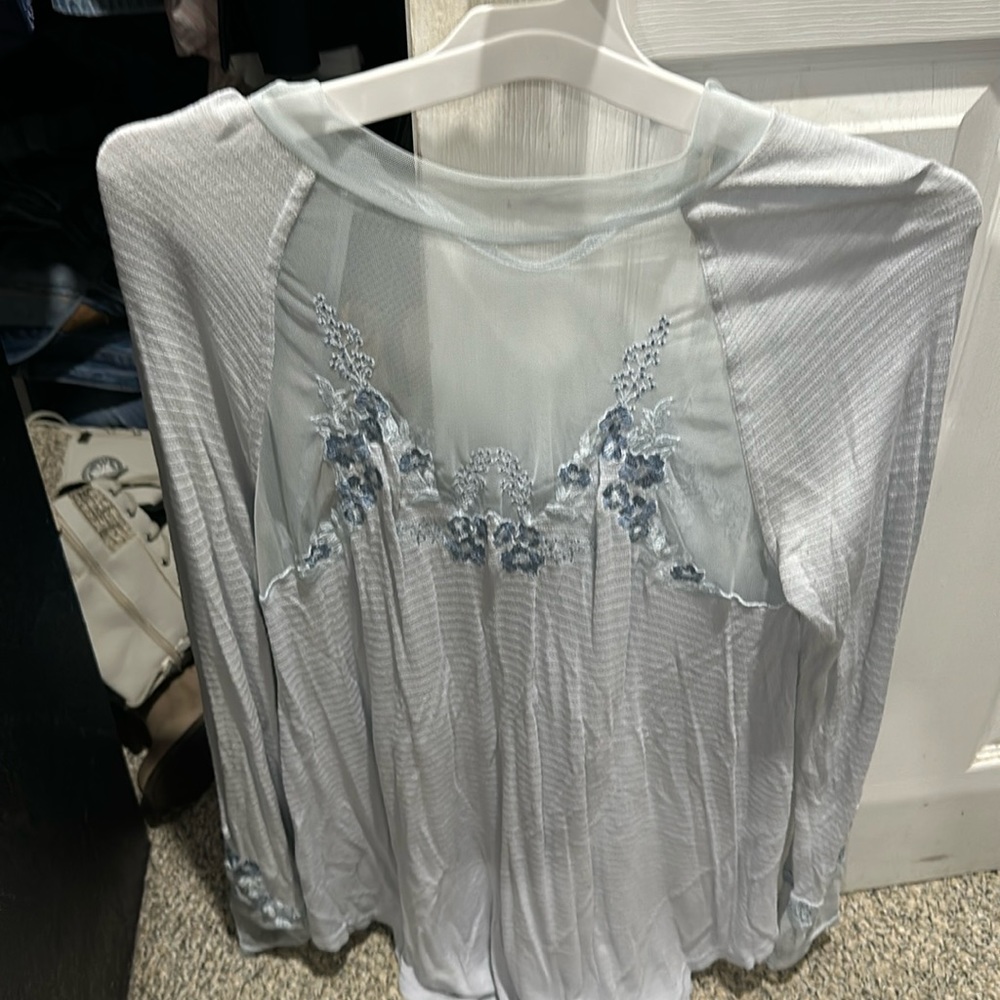 Beautiful light blue Free People small, with embroidered flowers on neck & arms